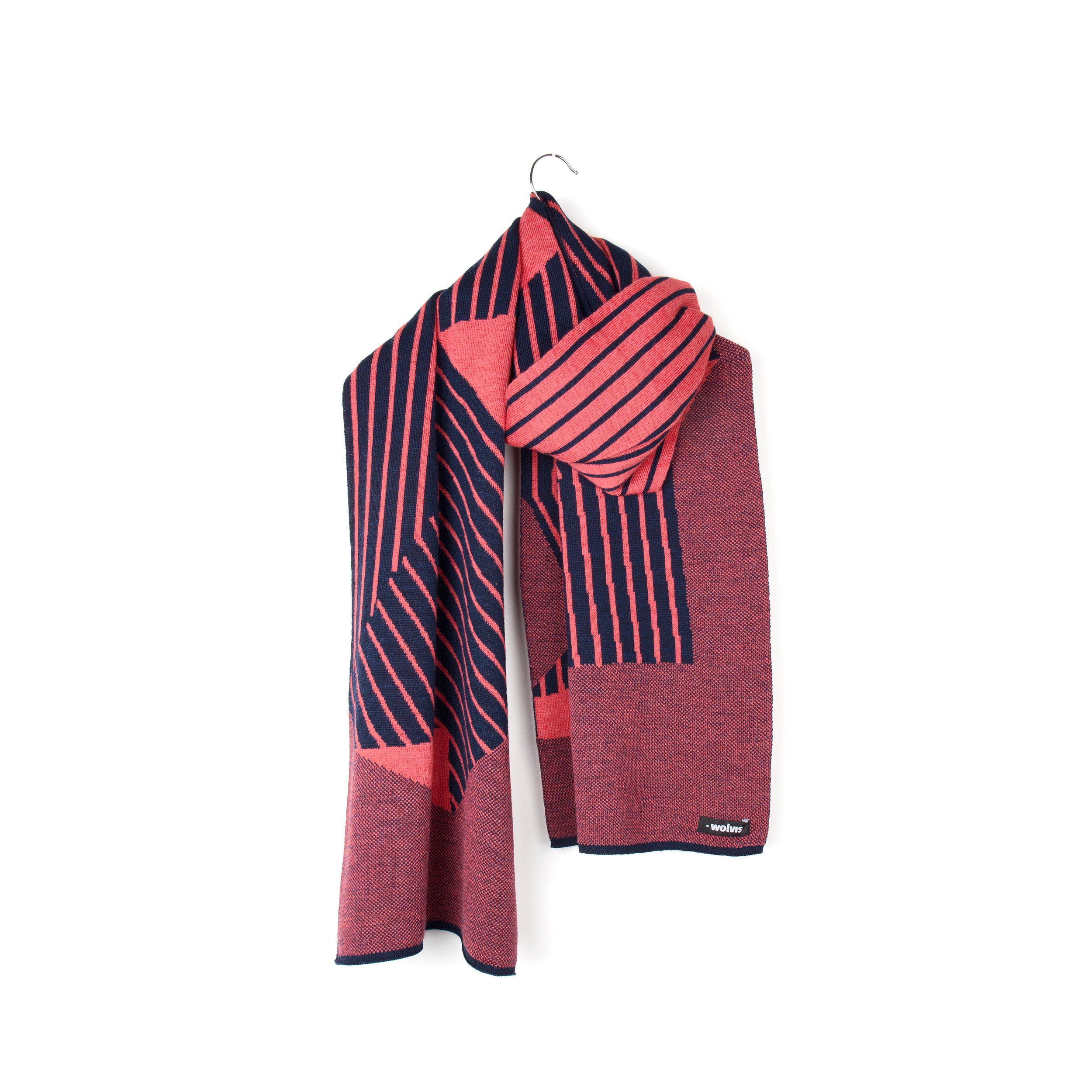 Packshot of a knit striped scarf in coral pink and dark blue.