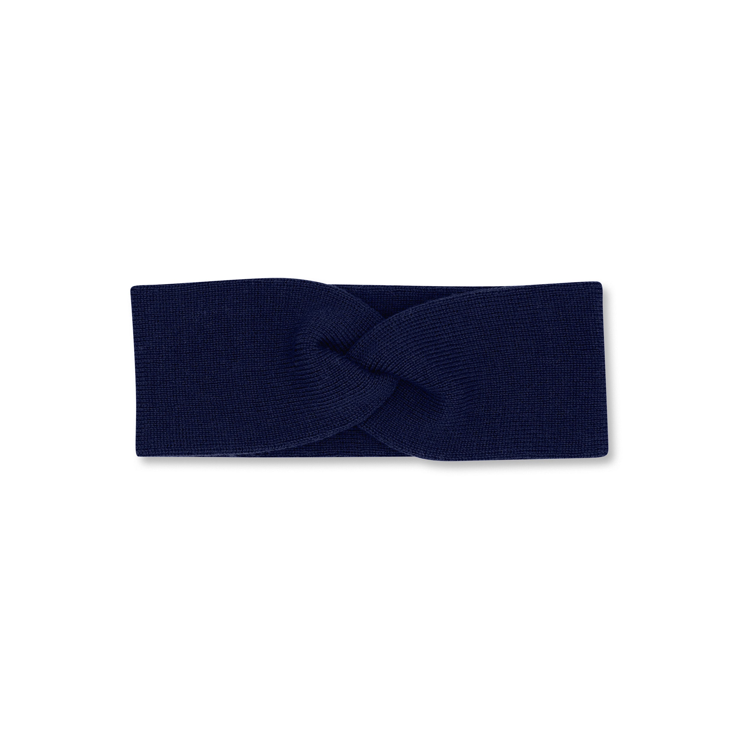 Product photo of a twisted indigo blue headband, set against a plain background.