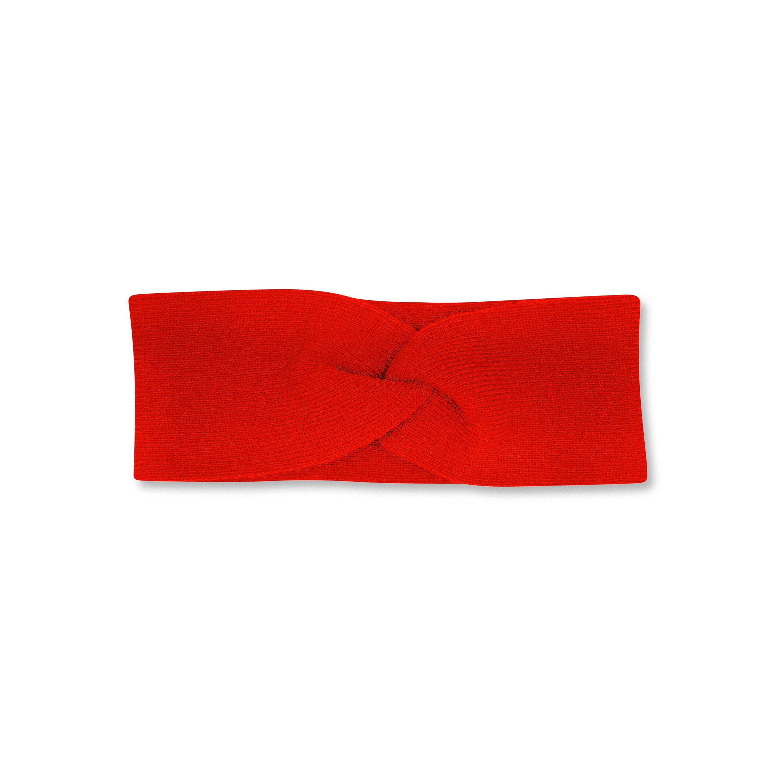 Product photo of a twisted bright red headband, set against a plain background.