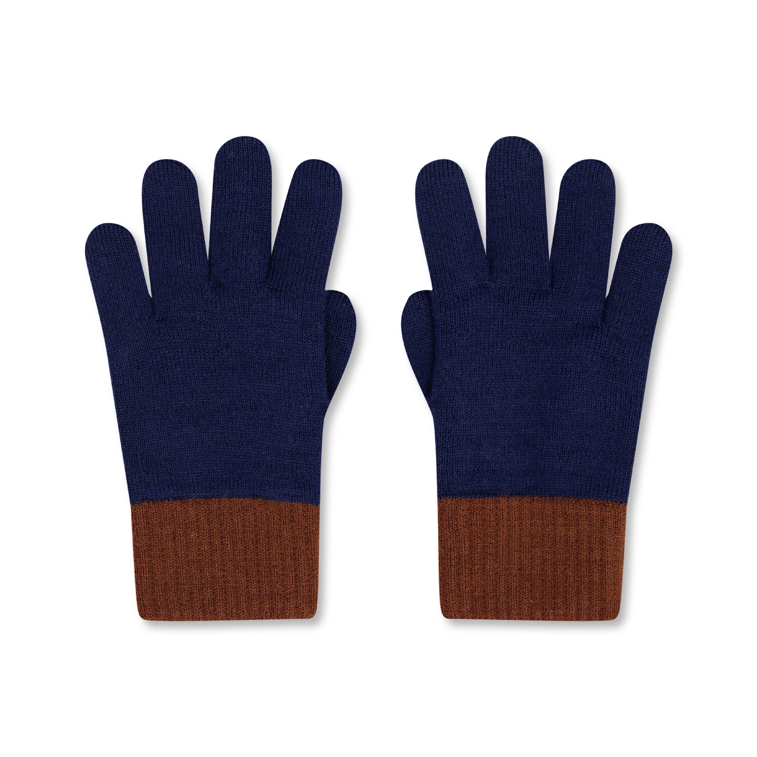 Product photo of a pair of indigo blue merino wool gloves with brown cuffs, laid flat on a neutral background.