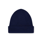 Product photo of an indigo blue wool beanie, displayed on a neutral background.